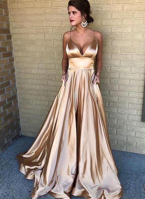 The Gold Suspender Gown by Marlowe House. Suspender straps, a V-neck, and a swing skirt with real movement. Simple in silhouette, rich in.