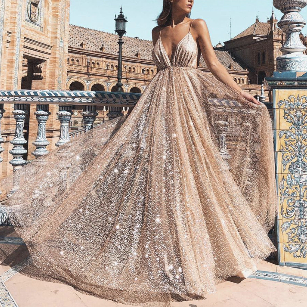 The Sling Swing Gown by Marlowe House. A sling silhouette, a swing skirt with real drama, finished in gold. Splice detailing at the seams.