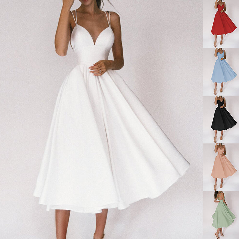 The Twirl Midi by Marlowe House. Spaghetti straps, a sweetheart V, and a full A-line skirt that moves like it means it. Tea-length.