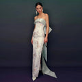 The Fishtail Evening Gown by Marlowe House. Sleeveless, a fishtail hem that hugs before it flares, in a soft light blue. Structured through the.