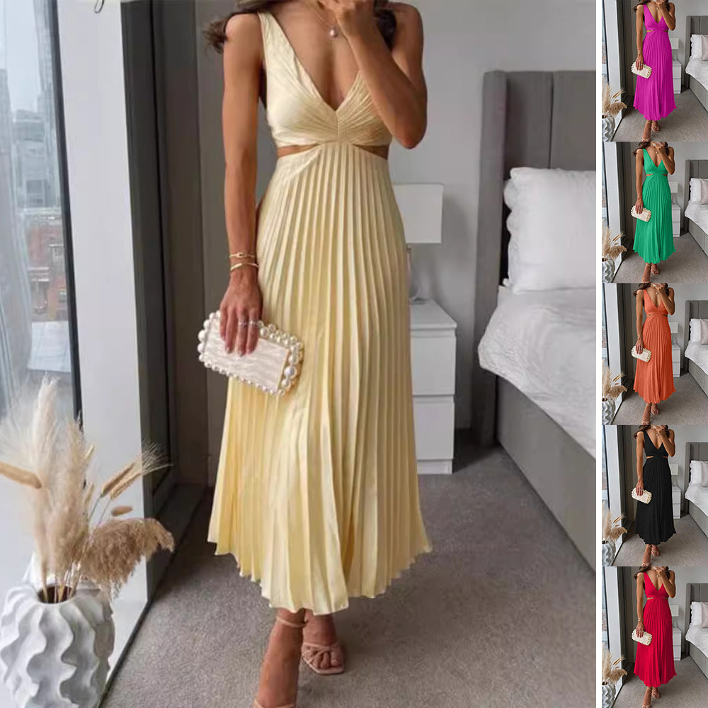 The Pleated Suspender Gown by Marlowe House. Pleated from waist to floor, a plunging V-neck, and a cutout at the waist that catches the light.
