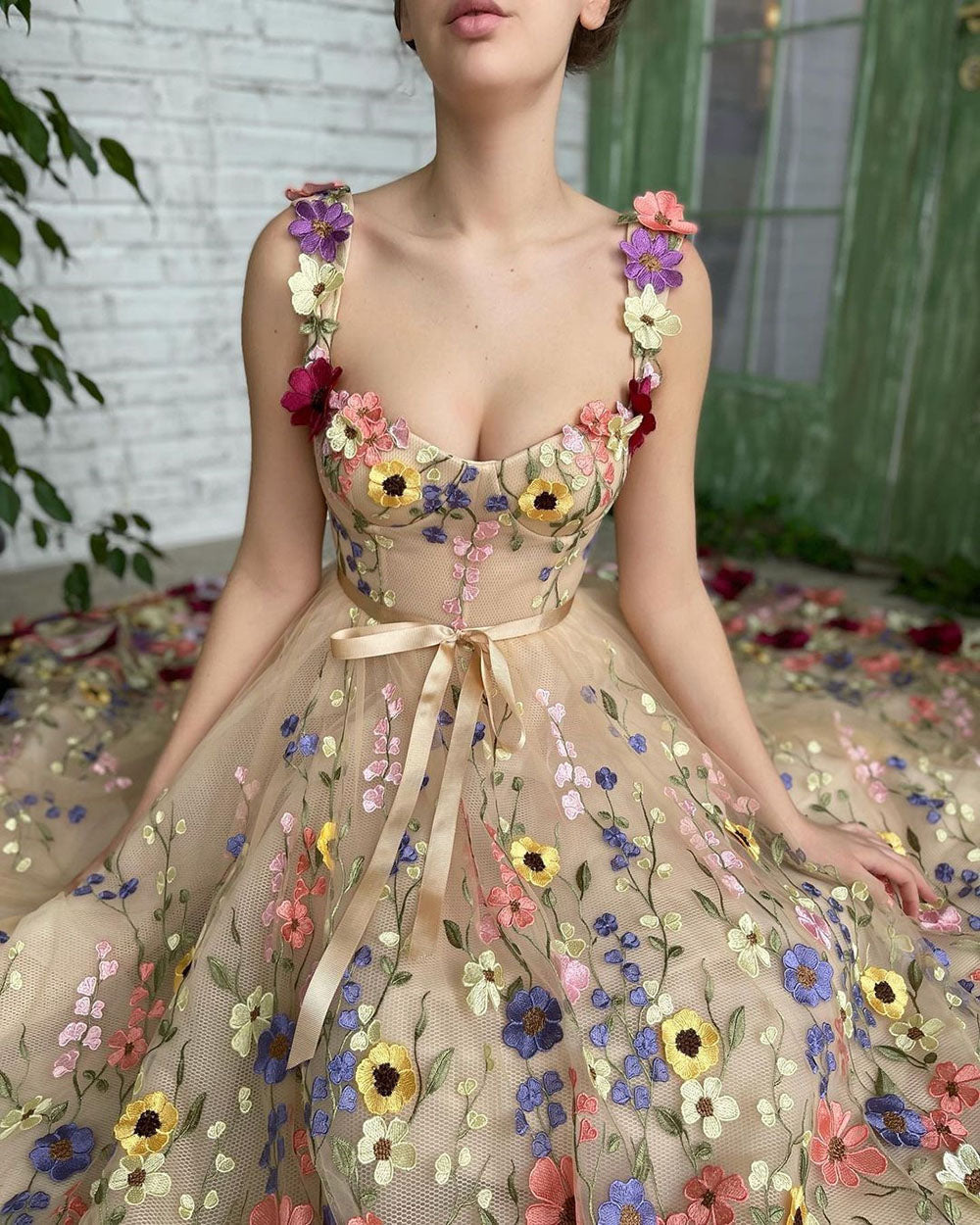 Hand-placed floral embroidery detail